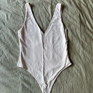 Babaton White Bodysuit One Piece with Deep V-neckline